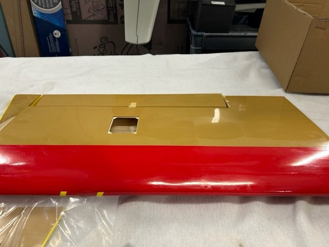 underside of a .60 drastik red and yellow plane
