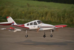 126" Cessna 310 landing on a runway