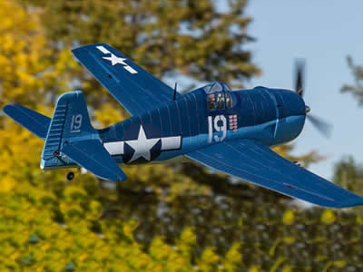 Dynam F6F Hellcat V2 1270mm (50") Wingspan - PNP flying in front of trees